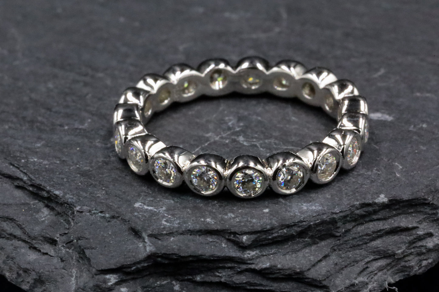 Round Moissanite Bezel Set Sterling Silver Eternity Ring