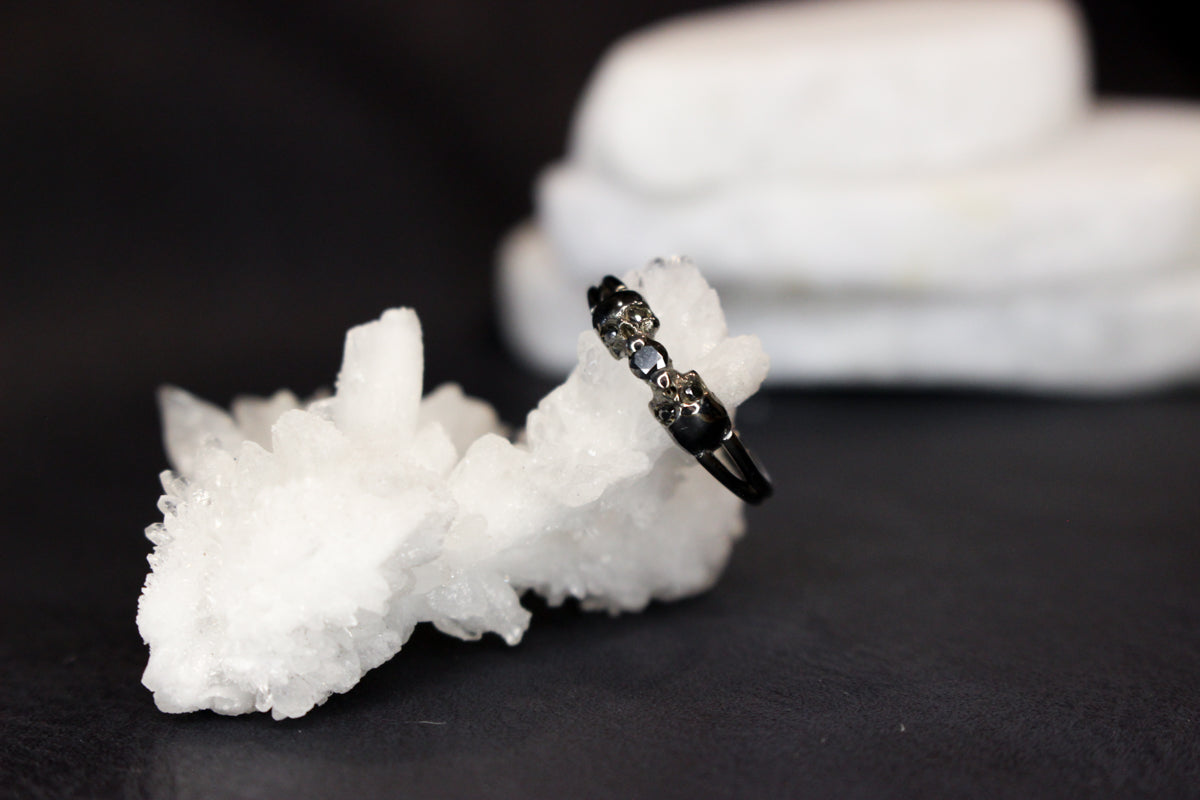 Black Metal and Black Moissanite Bezel Ring with Skulls